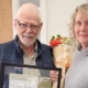 Community Futures North Okanagan board of directors member Mike Tindall presents board chair Michele Hill with the 2023 Volunteer of the Year Award.